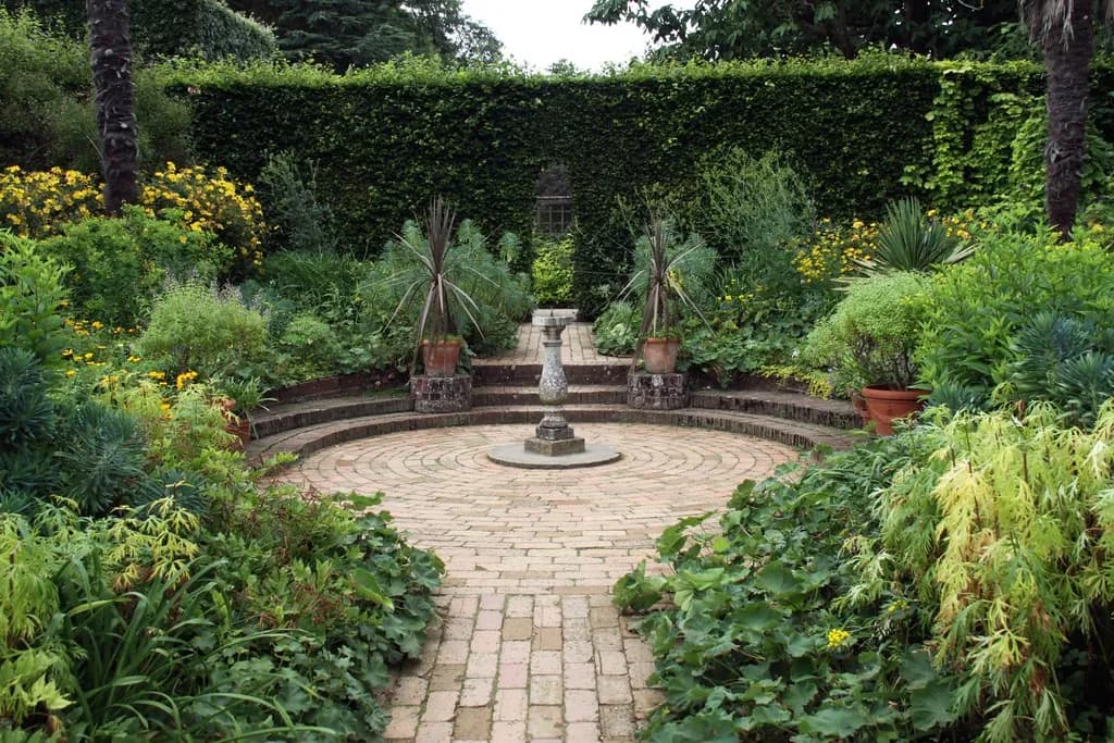 Paver walkway with steps through a garden