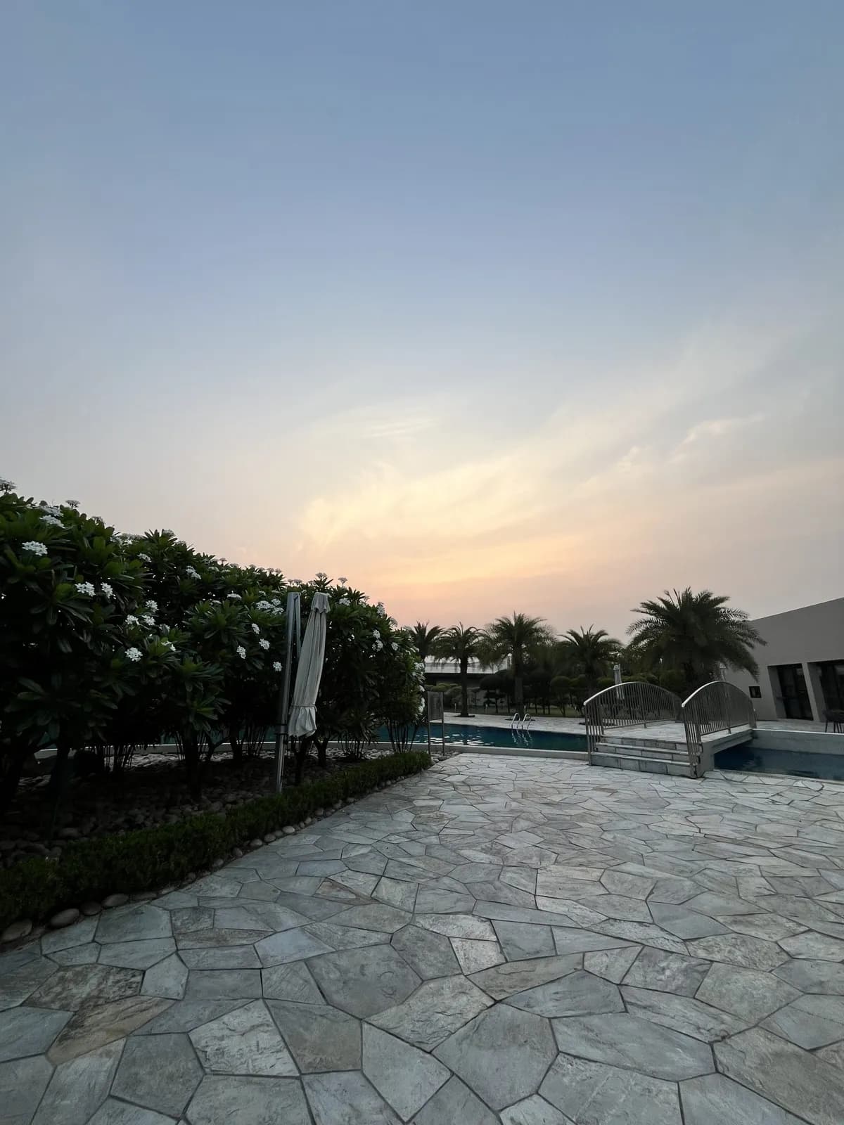 Paver pool deck surrounding a swimming pool